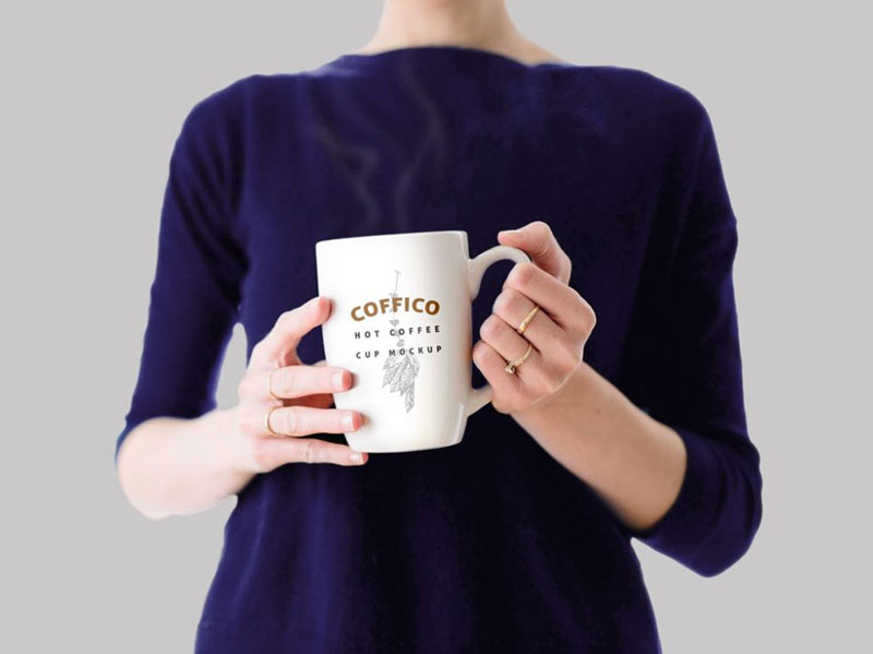 Free-Woman-Holding-A-Coffee-Mug-MockUp-PSD