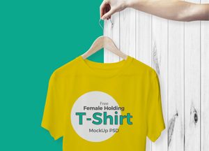 Free-Female-Holding-T-Shirt-Mockup-PSD-2017