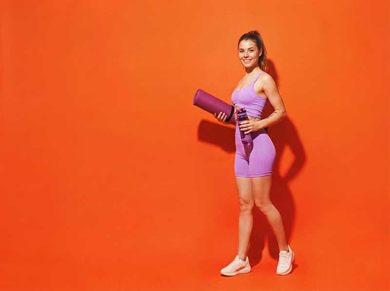 Full-body-young-fitness-trainer-instructor-woman