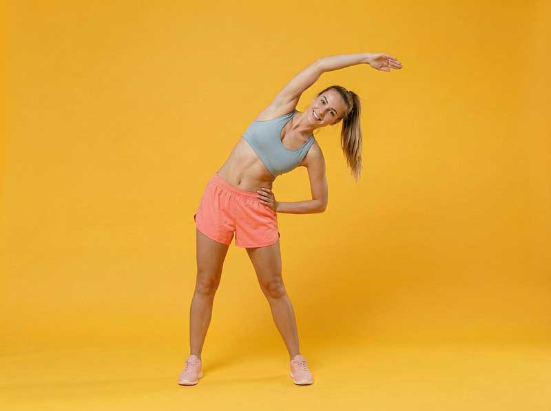 Full-length-portrait-of-smiling-fitness-woman