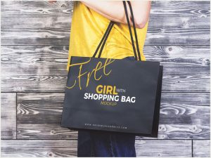 Free-Girl-Carrying-Shopping-Bag-MockUp