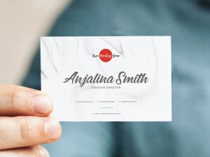 Free-Man-Holding-In-Hand-Business-Card-Mockup