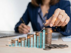 Businessman-holding-coins-putting-in-glass