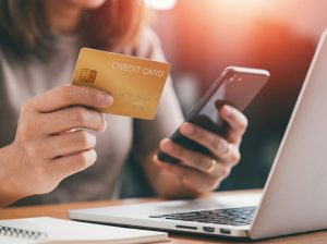 Close-up-Female-hands-holding-credit-card-and-smartphone